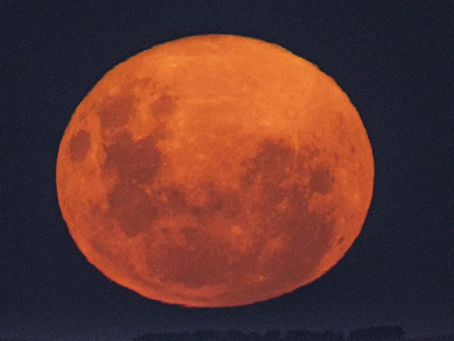 CANBERRA, AUSTRALIA APRIL 27, 2021: The first supermen for 2021. The super pink moon as it makes its closest approach to Earth this month. The super-moon was taken north of Canberra as it rose over Lake George.Picture: NCA NewsWire / Gary Ramage