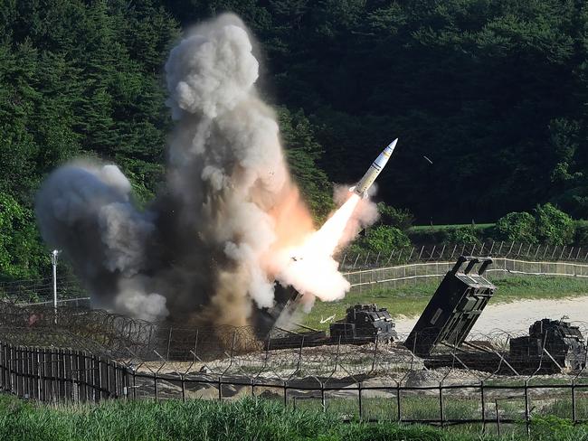 The US M270 Multiple Launch Rocket System fires an MGM-140 Army Tactical Missile during a US and South Korea joint missile drill aimed to counter North Korea's intercontinental ballistic missile test on July 5. Picture: South Korean Defence Ministry via Getty Images