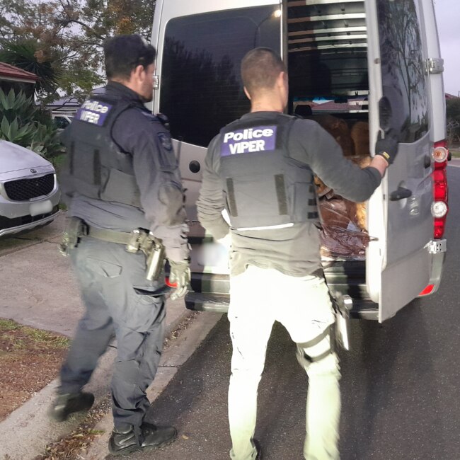 Members of the Viper Taskforce load illicit tobacco seized from a home in Delahey. Picture: Victoria Police