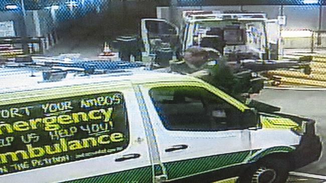 An ambulance officer chalking a protest message on a vehicle. Picture supplied by state government.