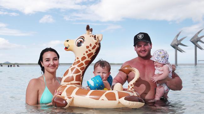 Cairns is currently experiencing a mixture of sunny weather and also cloudy and rainy skies. Sarah Castini, Tatum Castini, 2, Amarni Castini, 4 months, and Zehnyn Castini from Gordonvale took a dip in the Esplanade lagoon to cool off from the hot and humid weather. Picture: Brendan Radke