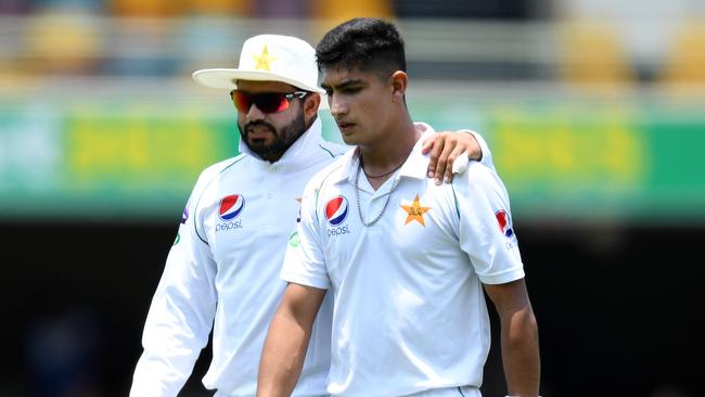 Pakistan captain Azhar Ali (left) speaks with Naseem Shah during his bowling spell on day two of the first Test Match between Australia and Pakistan at the Gabba in Brisbane, Friday, November 22, 2019. (AAP Image/Dave Hunt) NO ARCHIVING, EDITORIAL USE ONLY, IMAGES TO BE USED FOR NEWS REPORTING PURPOSES ONLY, NO COMMERCIAL USE WHATSOEVER, NO USE IN BOOKS WITHOUT PRIOR WRITTEN CONSENT FROM AAP