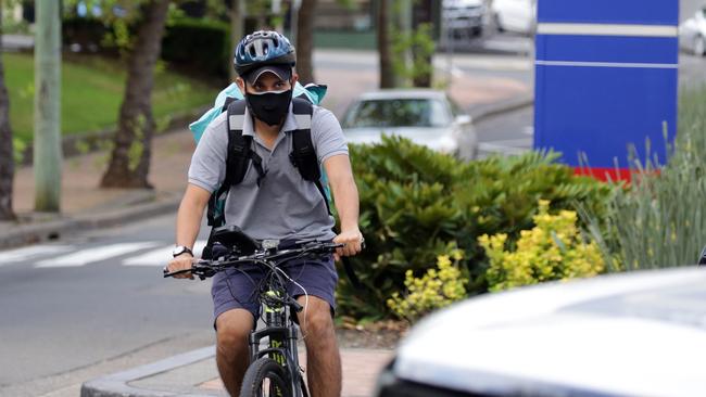 A Deliveroo rider outside St Vincent's Hospital in Darlinghurst. Picture: Christian Gilles