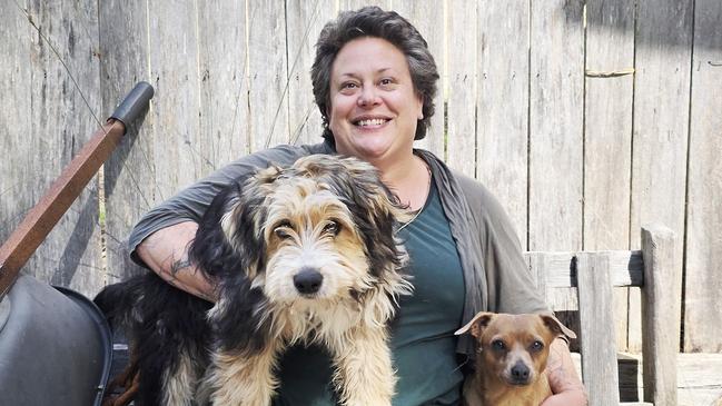 Stacey Ingram with her dogs and who no longer wants to swim at Randalls Bay beach after salmon debris washed ashore. Picture: supplied