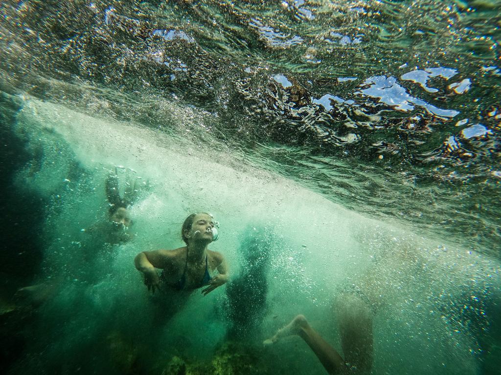 People swim underwater at Clovelly Beach in Sydney after a severe heatwave hit the state last week. Picture: Jenny Evans/Getty Images