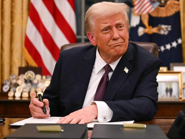 US President Donald Trump signs executive orders in the Oval Office of the White House in Washington, DC, on January 20, 2025. Picture: NewsWire / Jim WATSON / POOL / AFP