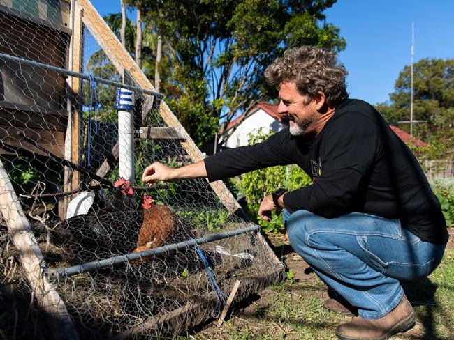 Adam Russell and his homemade chicken coop. Picture by Anna Warr