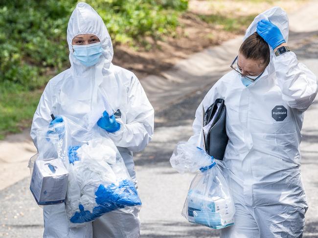 Police at the scene where the pair was shot dead. Picture: Jake Nowakowski