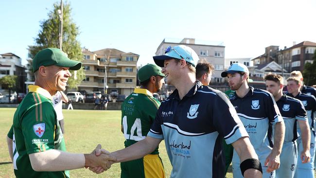 SYDNEY, AUSTRALIA - NOVEMBER 10:  David Warner of Randwick-Petersham and Steve Smith of Sutherland embrace at the end of the Sydney Grade Cricket One Day match between Randwick-Petersham and Sutherland at Coogee Oval on November 10, 2018 in Sydney, Australia.  (Photo by Mark Metcalfe/Getty Images)