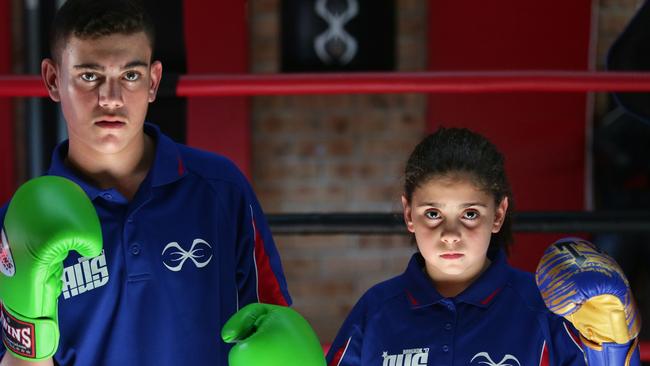 Callyum McAlister, 15, and Saffiyah El-Chrafi, 10, were members of a team of fighters representing Australia at a recent championship in Thailand. They train at the Final Round gym in Prestons. Picture: Ian Svegovic