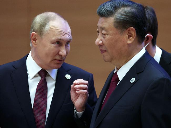 Russian President Vladimir Putin speaks to China's President Xi Jinping during the Shanghai Cooperation Organisation (SCO) leaders' summit in Samarkand on September 16, 2022. Picture: Sergei Bobylyov / Sputnik / AFP