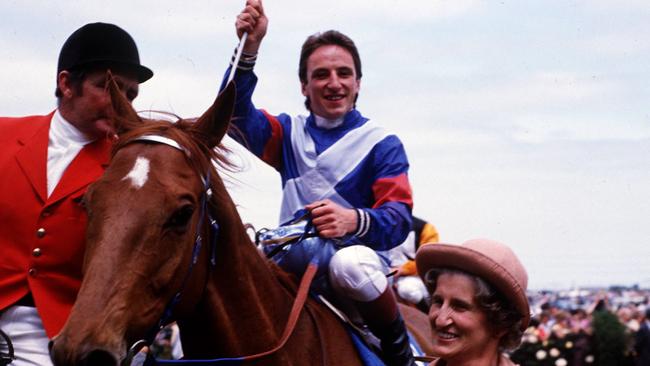 Kiwi is led by owner Anne Lupton after winning the 1983 Melbourne Cup at Flemington with jockey Jim Cassidy.