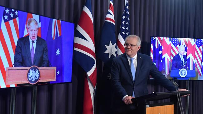 UK Prime Minister Boris Johnson (from left), Scott Morrison and US President Joe Biden at Thursday’s announcement. Picture: AAP