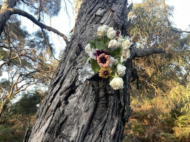 Flowers left at the scene on Campbell St in Wonthaggi where the 68-year-old woman was killed after she was allegedly hit by a car. Picture: Jack Colantuono