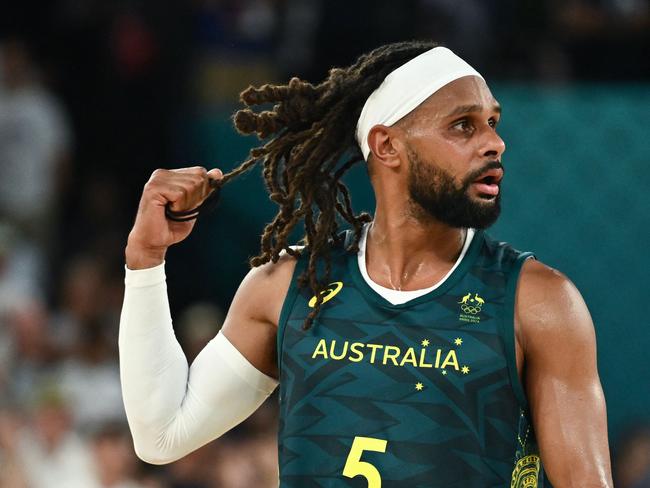 Australia's #05 Patty Mills reacts after in the men's quarterfinal basketball match between Serbia and Australia during the Paris 2024 Olympic Games at the Bercy  Arena in Paris on August 6, 2024. (Photo by Aris MESSINIS / AFP)