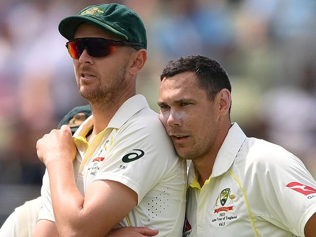 BIRMINGHAM, ENGLAND - JUNE 19: Scott Boland of Australia (C) leans on team mate Josh Hazlewood as they watch the big screen during a review for the wicket of Jonny Bairstow of England which is given not out during Day Four of the LV= Insurance Ashes 1st Test match between England and Australia at Edgbaston on June 19, 2023 in Birmingham, England. (Photo by Stu Forster/Getty Images)