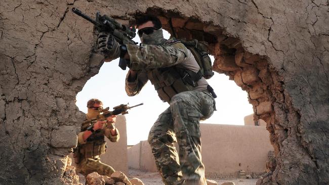 Special Operations Task Group (SOTG) soldiers enter the training compound at Multi National Base Tarin Kowt in Uruzgan Province of Afghanistan. Picture: Corporal Chris Moore.