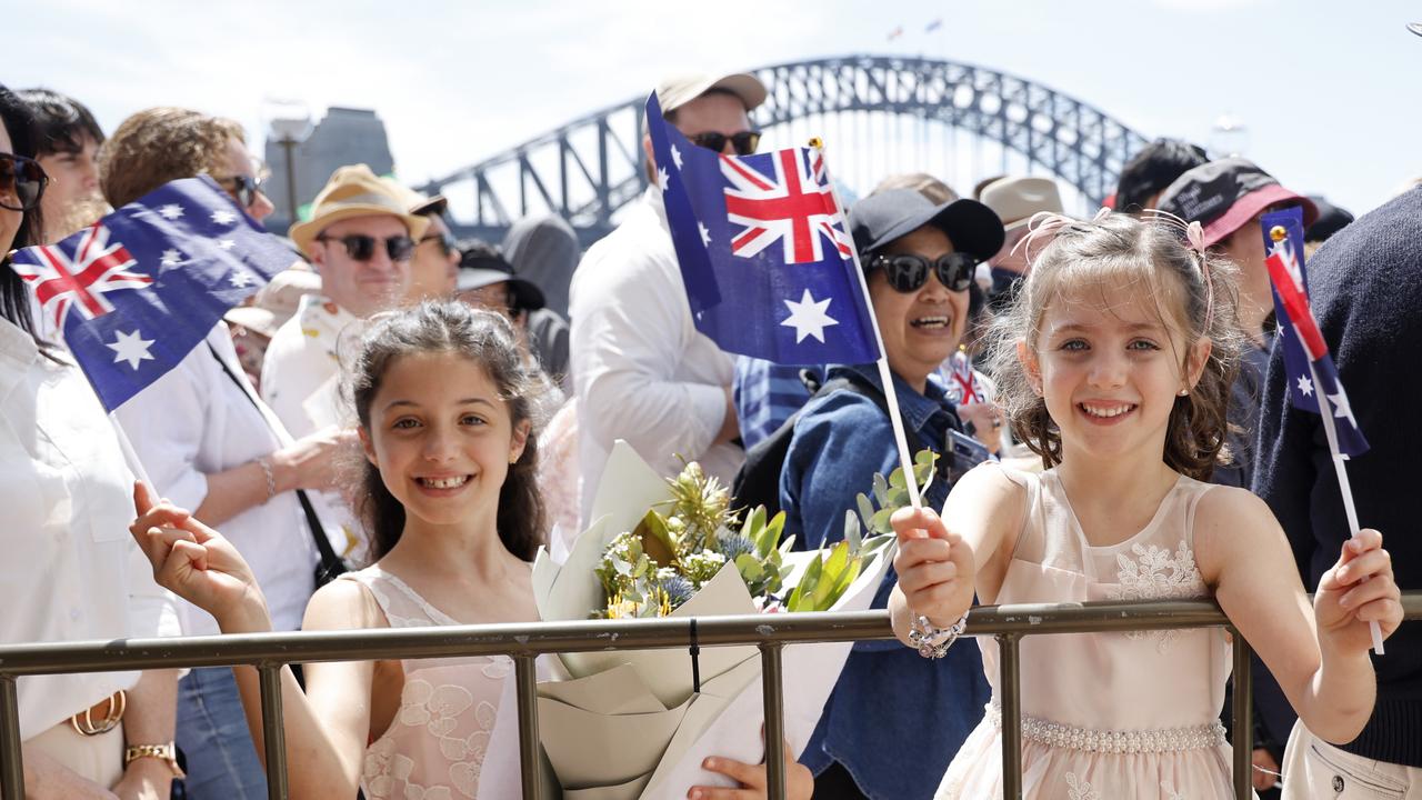 Grace Wright (9) and Charlotte Finn (6) queue up to to see the King and Queen outside the Sydney Opera House. Picture: NewsWire / Damian Shaw