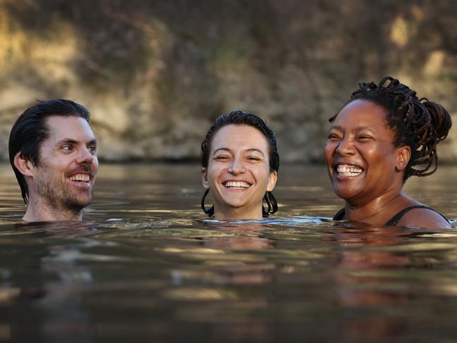 Tom Statham, Yasmina Dkhissi and Charity Mosienyane enjoy the tranquil cool water of the Yarra River at Deep Rock swimming hole. Picture: David Caird