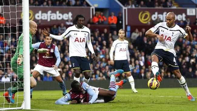 Tottenham Hotspur's French defender Younes Kaboul (2nd R) takes a shot at goal.