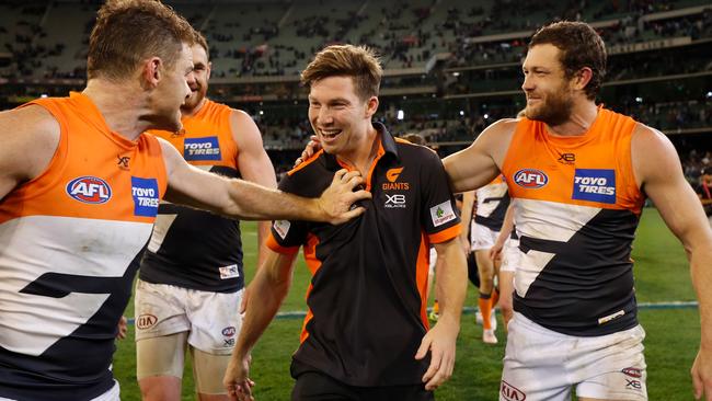 Toby Greene celebrates Saturday’s preliminary final win with teammates Heath Shaw and Sam Reid. Picture: AFL Photos/Getty Images.