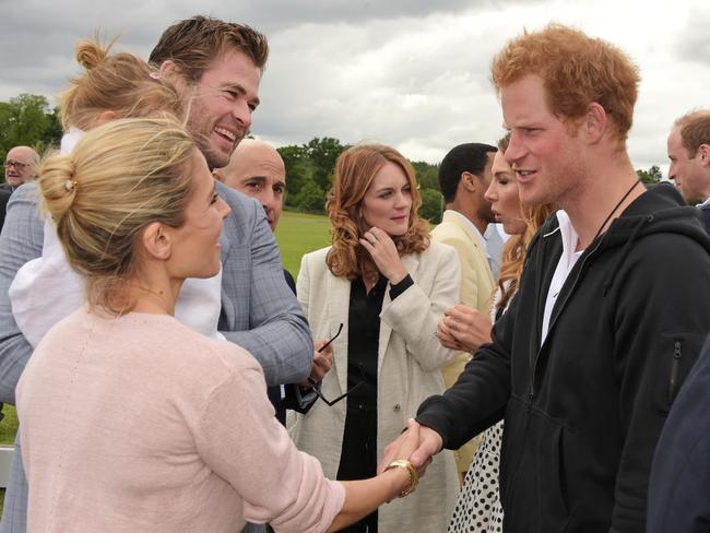 Pleased to meet you ... Elsa Pataky, daughter India Rose Hemsworth, Chris Hemsworth meets Prince Harry. Picture: Getty