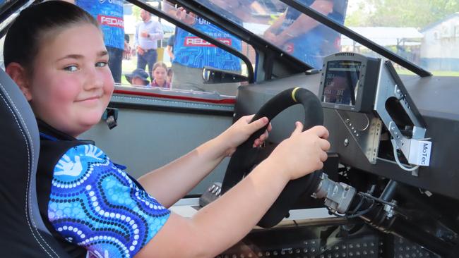 Grade 6 Palmerston Christian College student Niamh Turner inside the driver's seat of the solar car, Monday, October 16, 2023. Picture: Darcy Jennings.