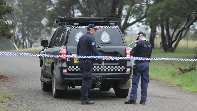 Police cordon off a farm in the Southern Tablelands region of Bungonia, where the bodies were found. Picture: NCA NewsWire / Max Mason-Hubers