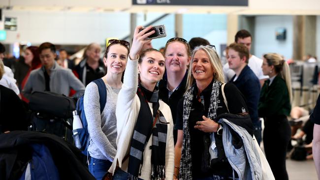 Nurses from around Queensland heading off to Victoria from Brisbane Airport on Sunday. Picture: David Clark