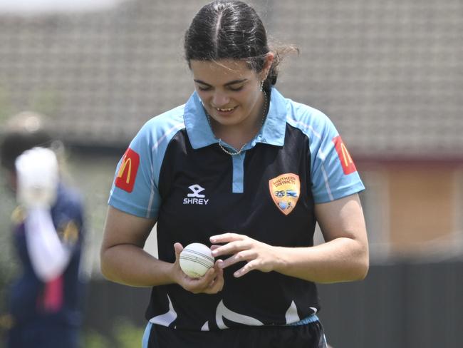 QUEANBEYAN, AUSTRALIA. DECEMBER 19, 2023: 10 Natalia Egan (Bowling). Southern Districts U16 (Fielding/ light blue) vs Riverina (Batting / red&blue) during the Mcdonald's Under 16 Female Country Championships at Freebody Ovals, Queanbeyan New South Waless. Picture: Martin Ollman