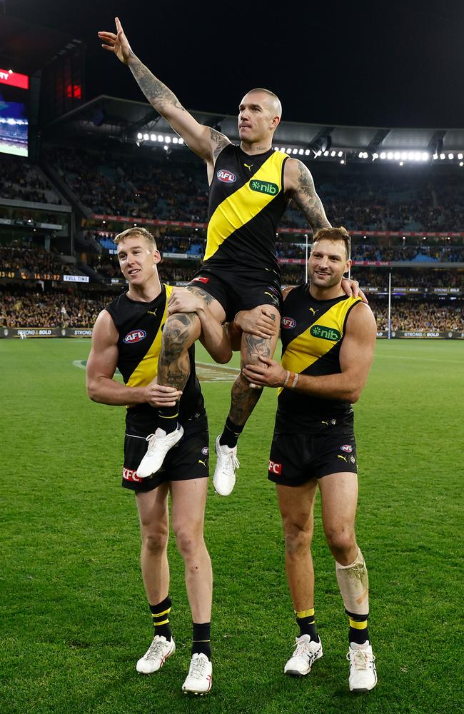 Dustin Martin is chaired from the field by teammates Tom Lynch and Toby Nankervis. Picture: Michael Willson/AFL Photos