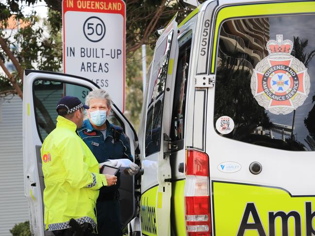 August 7, 2020, Griffith Street Coolangatta, Queensland Police remove two elderly passengers from an Interstate Bus and as a result a Passenger suffered a medical emergency and Queensland Ambulance Officers attended. Upon attending and ascertaining the details Ambulance Officers then put on face masks, assisted the elderly male and then conveyed him to Hospital. Picture Scott Powick Newscorp