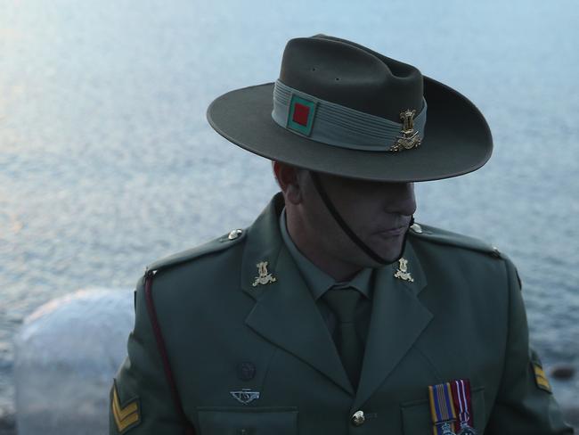 ECEABAT, TURKEY - APRIL 22: Corporal Andrew Barnett of the Australian Army Band, who will play the bugle at the upcoming Dawn Service commemoration ceremony to honour Australian and New Zealand soldiers killed in the Gallipoli Campaign, stands at Anzac Cove on April 22, 2015 near Eceabat, Turkey. Allied and Turkish representatives, as well as family members of those who served, will commemorate the 100th anniversary of the campaign with ceremonies scheduled for April 24-25. The Gallipoli land campaign, in which a combined Allied force of British, French, Australian, New Zealand and Indian troops sought to occupy the Gallipoli peninsula and the strategic Dardanelles strait during World War I, began on April 25, 1915 against Turkish forces of the Ottoman Empire. The Allies, unable to advance more than a few kilometers, withdrew after eight months. The campaign cost the Allies approximately 45,000 killed and up to 200,000 wounded, the Ottomans approximately 85,000 killed and 160,000 wounded. (Photo by Sean Gallup/Getty Images) *** BESTPIX ***