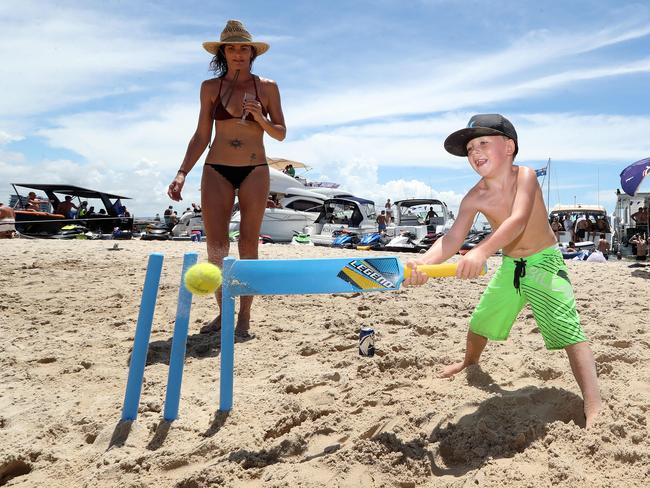 Australia Day on the Broadwater. Photo at Wavebreak Island of Ashton Massey, 5, Labrador with Ursula Oglivie from Airlie Beach. Photo by Richard Gosling