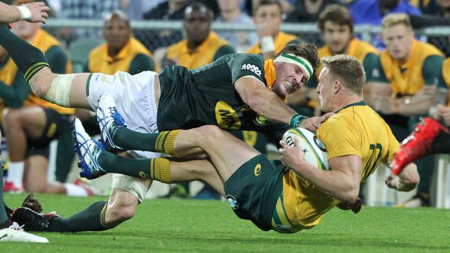 Reece Hodge of the Wallabies is tackled by Jaco Kriel of the Springboks.