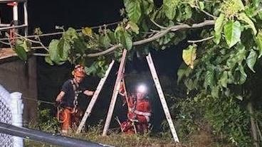 Rescue workers helping a man who plunged from Darwin cliffs in the CBD