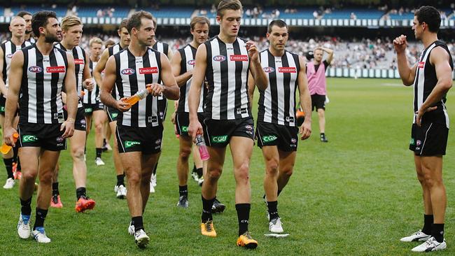 Disappointed Collingwood players leave the field after the loss to Carlton. Picture: Michael Klein