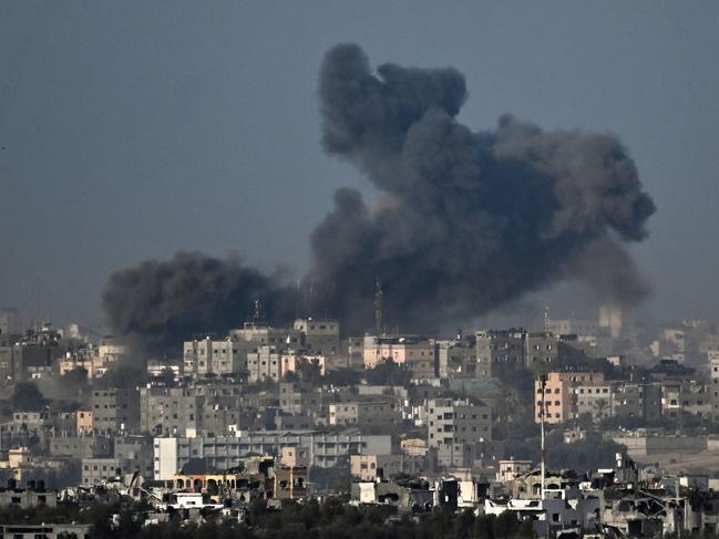 This picture taken from Sderot along the border with the Gaza Strip on November 7, 2023, shows smoke rising from Gaza after Israeli strikes.