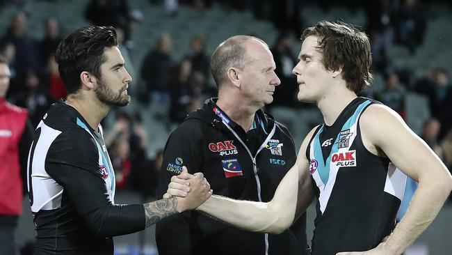 Chad Wingard with Jared Polec and Ken Hinkley after Port Adelaide’s final-round loss. Both will likely be in opposition colours next year. Picture Sarah Reed