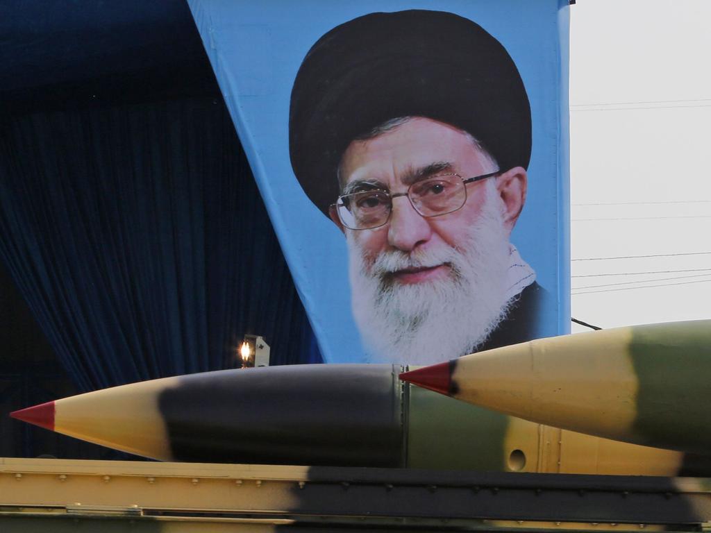 An Iranian military truck carrying missiles past a portrait of Iran's Supreme Leader Ayatollah Ali Khamenei. Iran routinely imagines the destruction of Israel. Picture: AFP