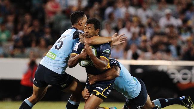 Aidan Toua of the Brumbies is tackled high by Israel Folau of the Waratahs.