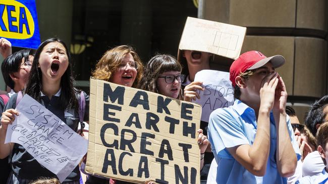 Placard-waving students demand action on climate change at Martin Place. Picture: Jenny Evans