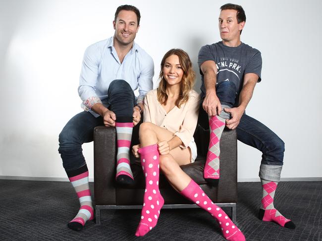 Sasha, Sam and Rove pull up their socks for the McGrath Foundation appeal. Picture: Chris Pavlich