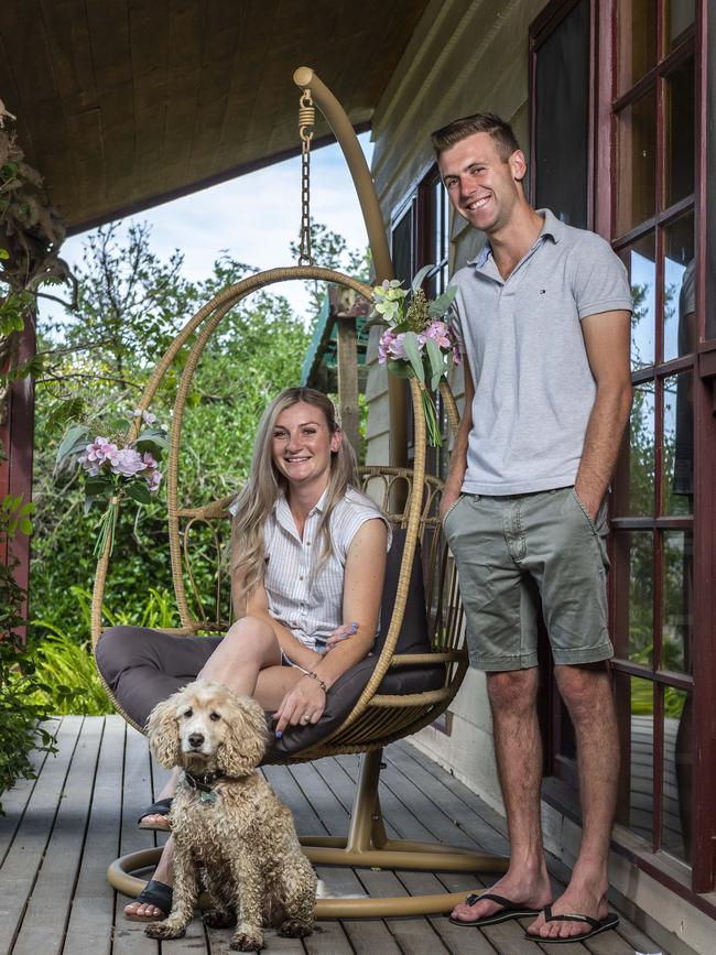 Jamie Kah, finace Clayton Douglas and Bubble relaxing at home on the Mornington Peninsula. Picture: Jake Nowakowski