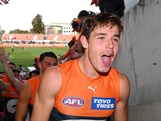 CANBERRA, AUSTRALIA - AUGUST 04: Aaron Cadman of the Giants celebrates victory during the round 21 AFL match between Greater Western Sydney Giants and Hawthorn Hawks at Manuka Oval, on August 04, 2024, in Canberra, Australia. (Photo by Morgan Hancock/Getty Images)