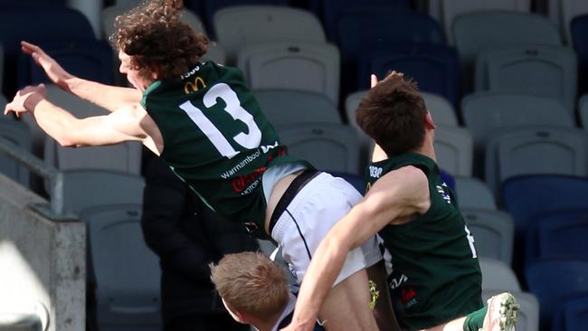 Hampden’s Rhys Buck gets plenty of air as he tries to take a mark. Picture Yuri Kouzmin