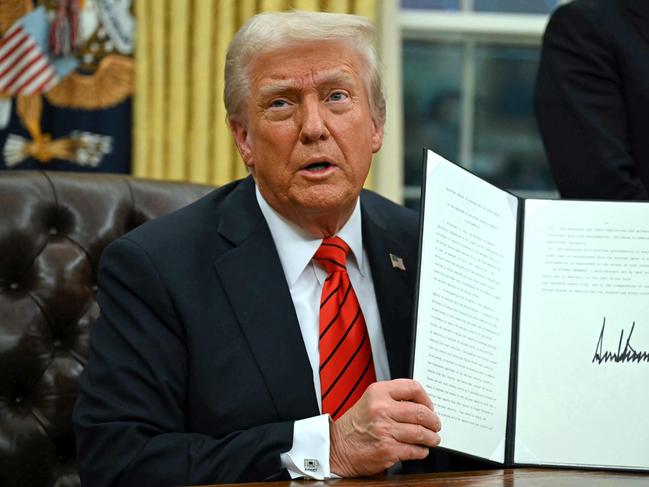 US President Donald Trump signs an executive order in the Oval Office on February 10, 2025, in Washington, DC. Picture: Andrew Caballero-Reynolds/AFP