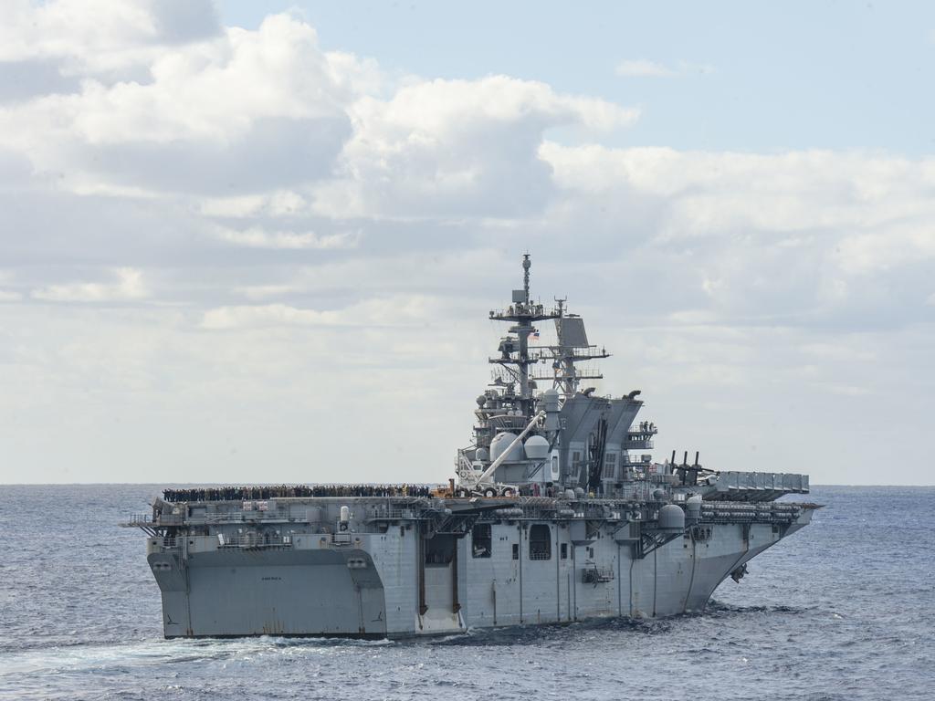 210722-N-XB010-1007 CORAL SEA (July 22, 2021) USS America (LHA 6) steams in formation alongside partner nations and allies during Talisman Sabre (TS) 21. This is the ninth iteration of Talisman Sabre, a large-scale, bilateral military exercise between Australia and the U.S. involving more than 17,000 participants from seven nations. The month-long multi-domain exercise consists of a series of training events that reinforce the strong U.S./Australian alliance and demonstrate the U.S. MilitaryÃ¢â&#130;¬â&#132;¢s unwavering commitment to a free and open Indo-Pacific. (U.S. Navy photo by Mass Communication Specialist 2nd Class Desmond Parks)