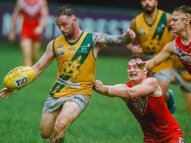 Jack Landt gets the ball away from Waratahs defence   in Round 16 NTFL Men's Premiership League as  Waratah v St Mary's.Picture Glenn Campbell