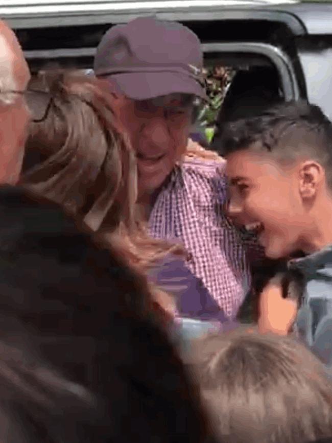 Obeid hugged by one of his grandsons.